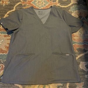 Figs 3 pocket scrub top.   No flaws.   Only worn a couple times.